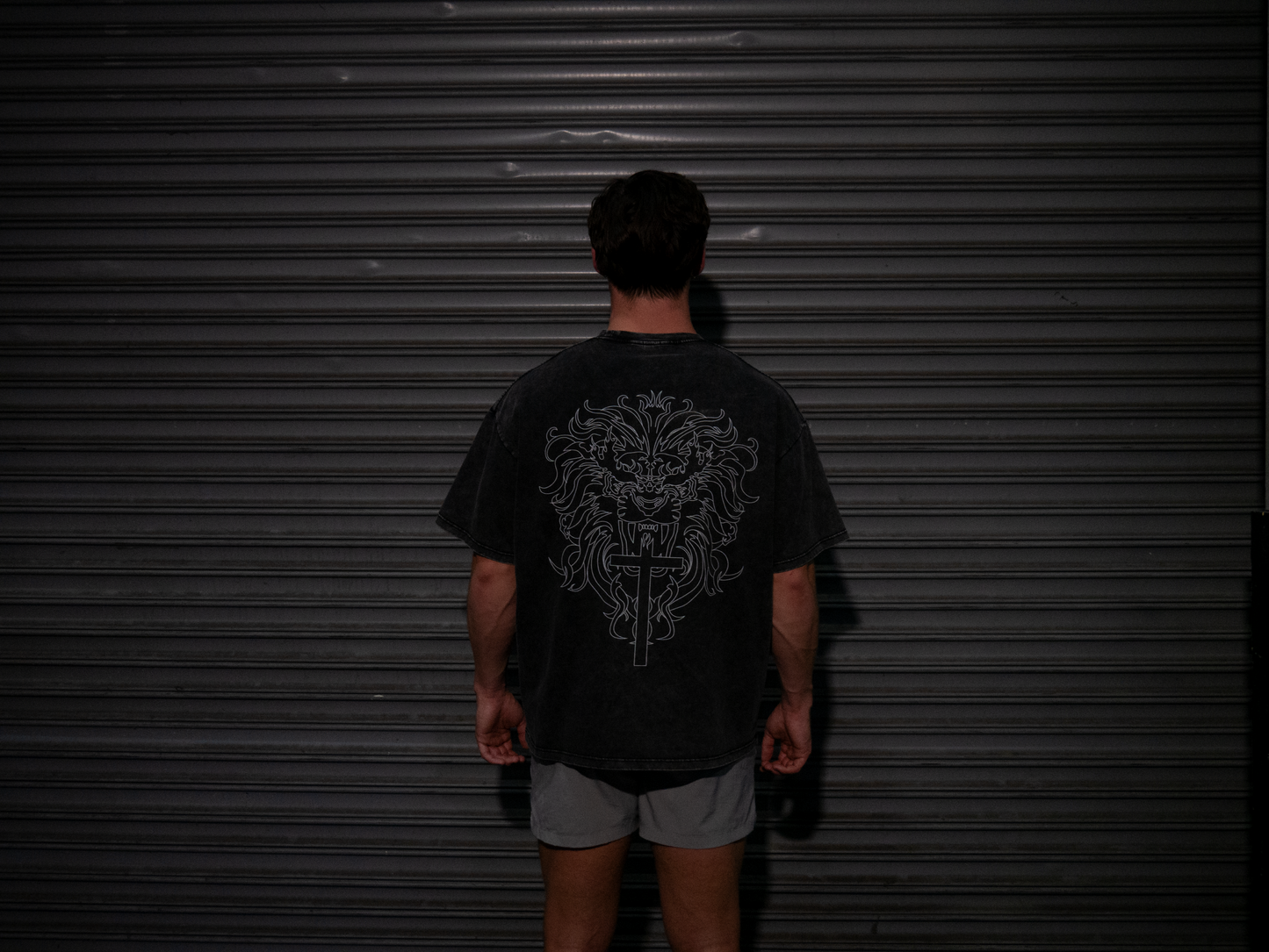 Christian gym clothes inspired by book of revelation & lion of Judah, oversized christian shirts, Mens christian clothing, black, back on model
