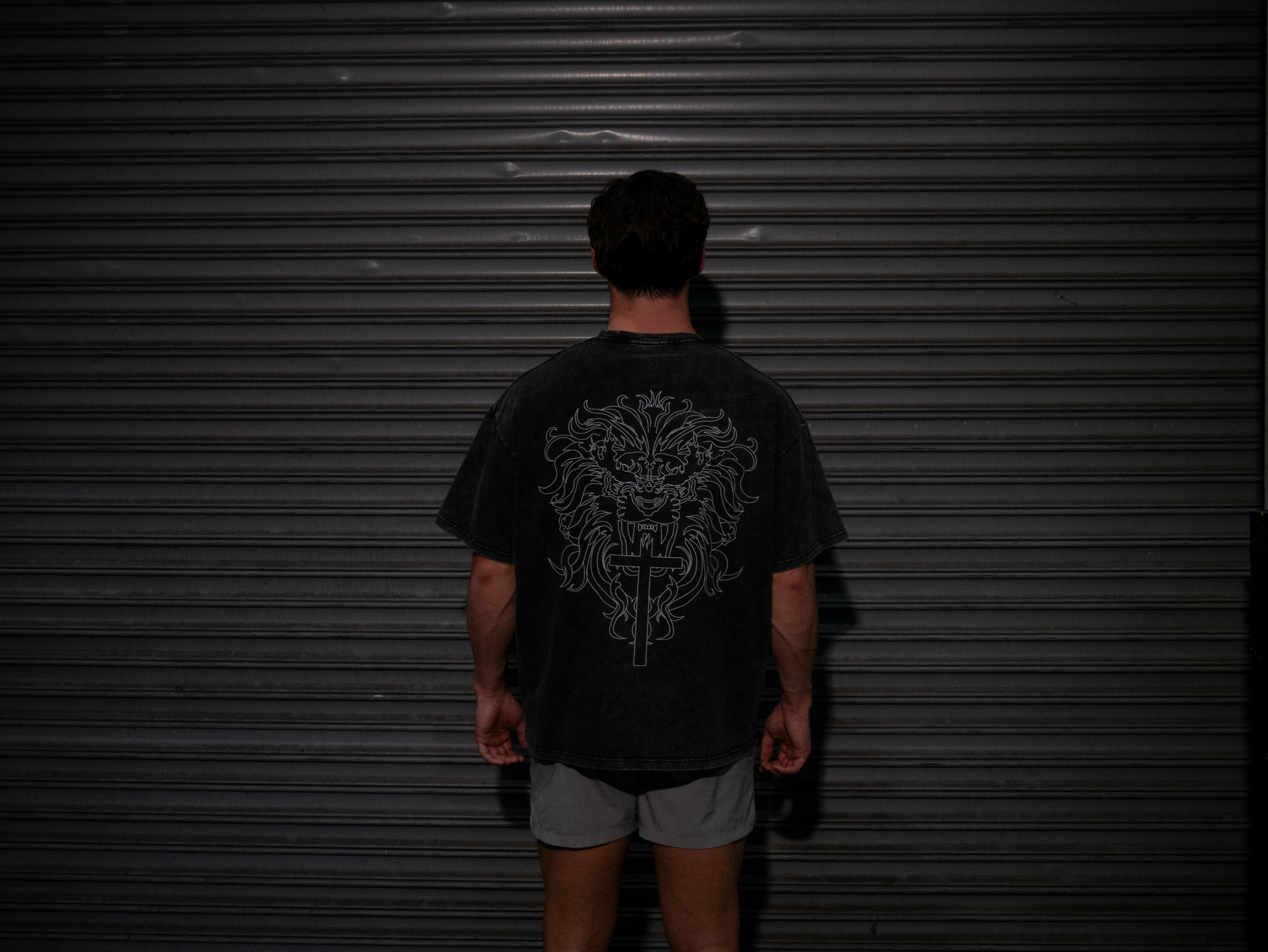 Christian gym clothes inspired by book of revelation & lion of Judah, oversized christian shirts, Mens christian clothing, black, back on model
