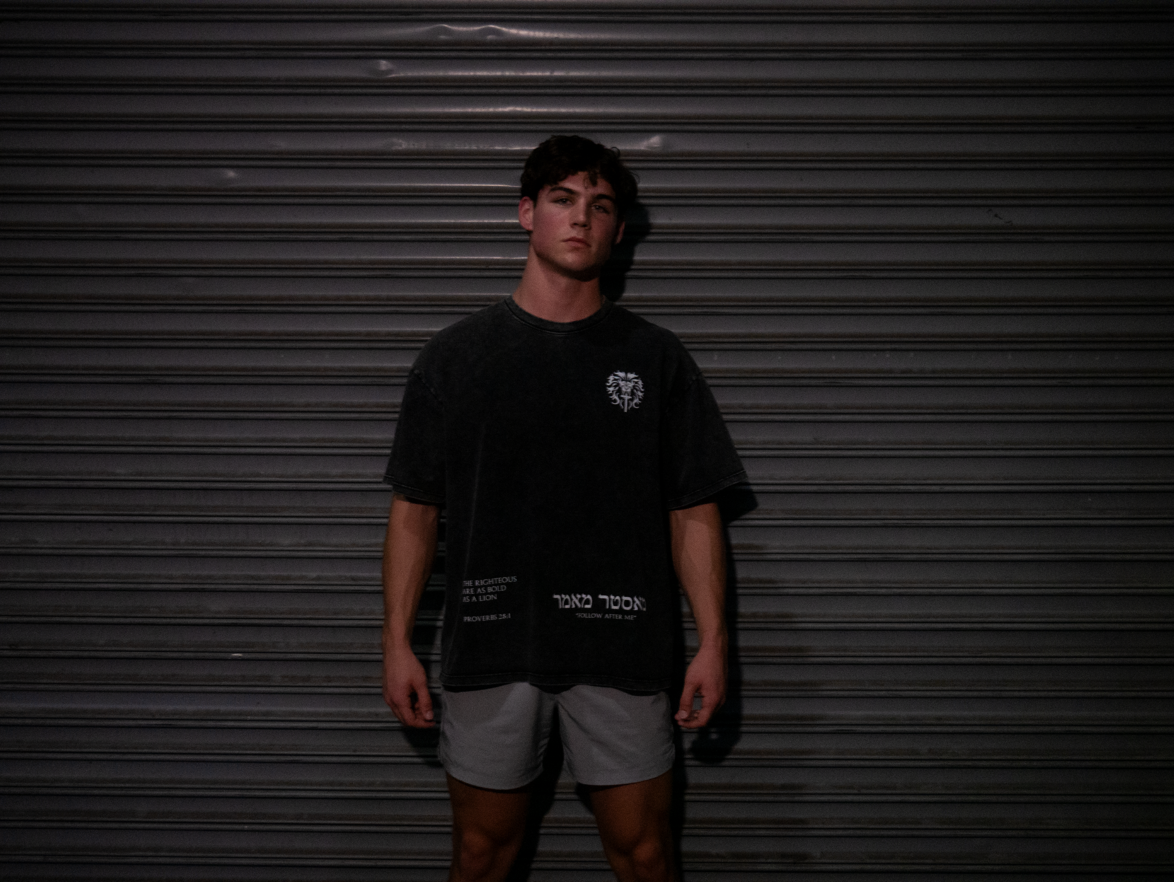 Christian gym clothes inspired by book of revelation & lion of Judah, oversized christian shirts, Mens christian clothing, black, front on model
