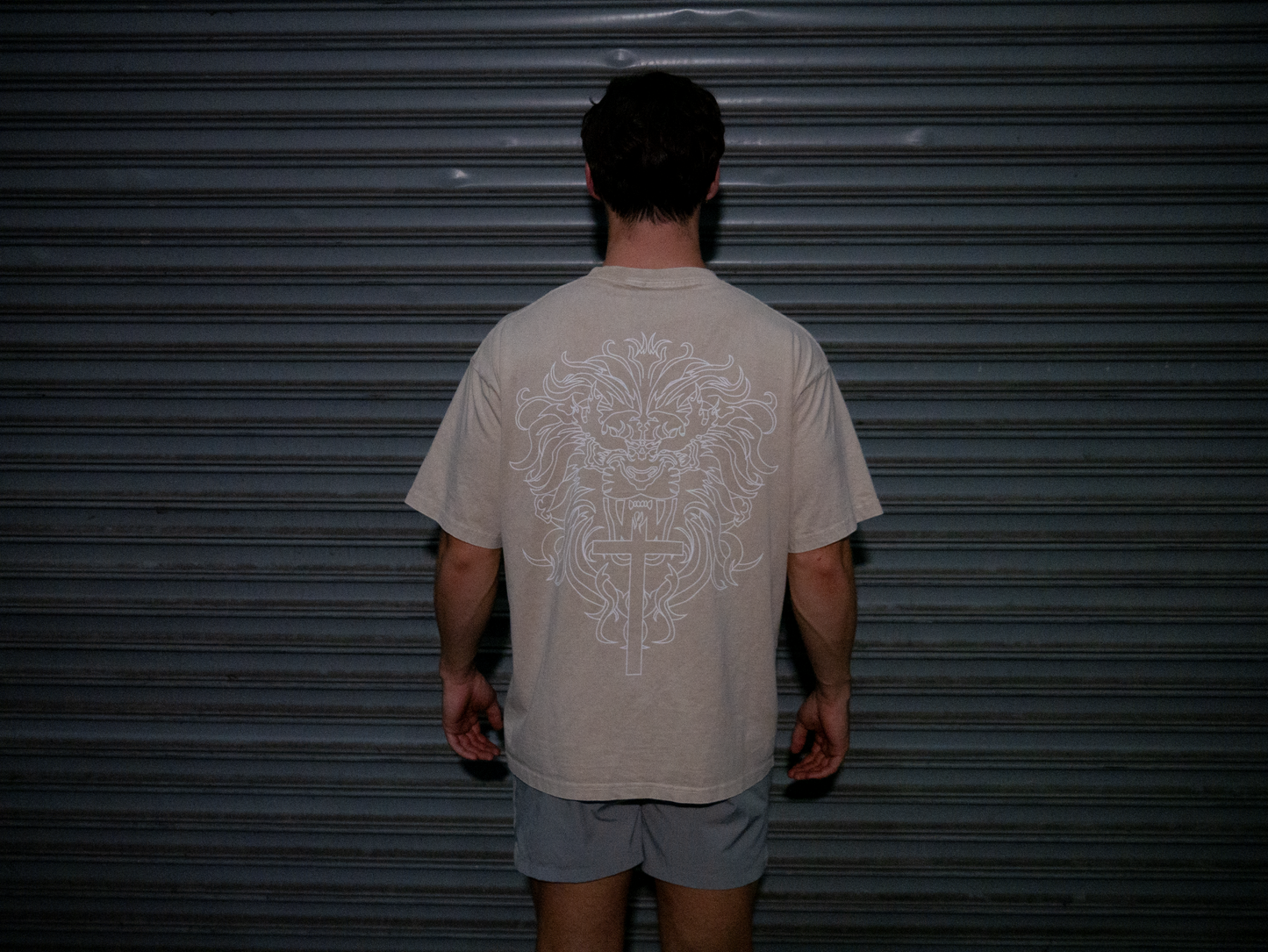 Christian gym clothes inspired by book of revelation & lion of Judah, oversized christian shirts, Mens christian clothing, tan, back on model
